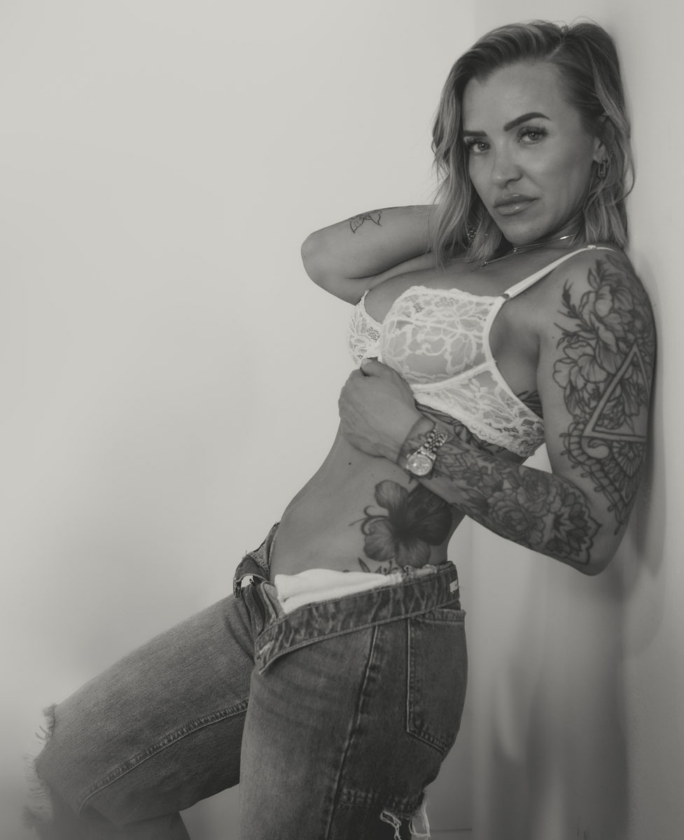 The coach is leaning on the wall.